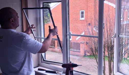 photo of dan fitting double glazing unit